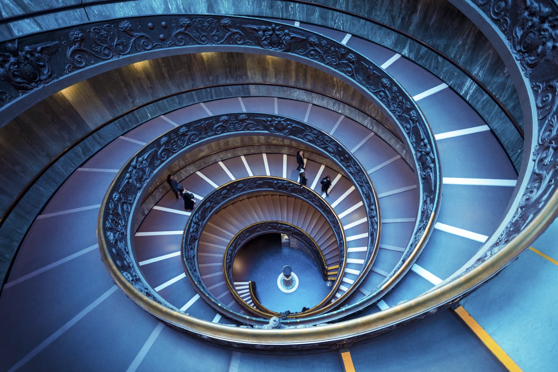 image of colourised spiral staircase, taken from above