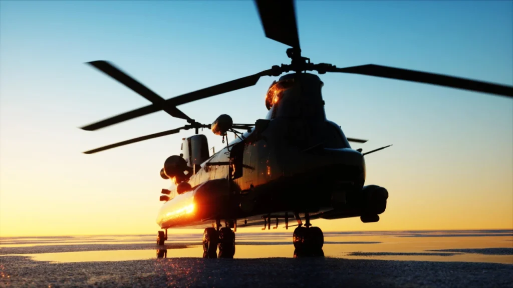 a photo of a chinook military helicopter at sunrise